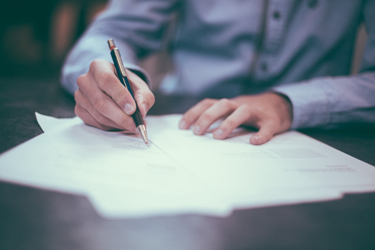 Business professionals signing a contract representing waiver of subrogation in Wisconsin